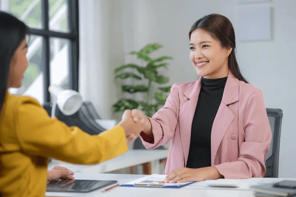 successful job interview symbolized by shaking hands